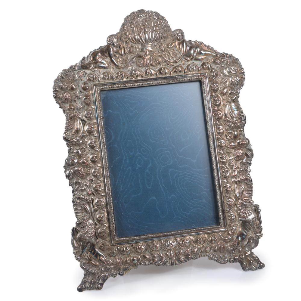 Appraisal: LARGE SILVER PLATED EASEL BACK PICTURE FRAME WITH NEOCLASSICAL MOTIF