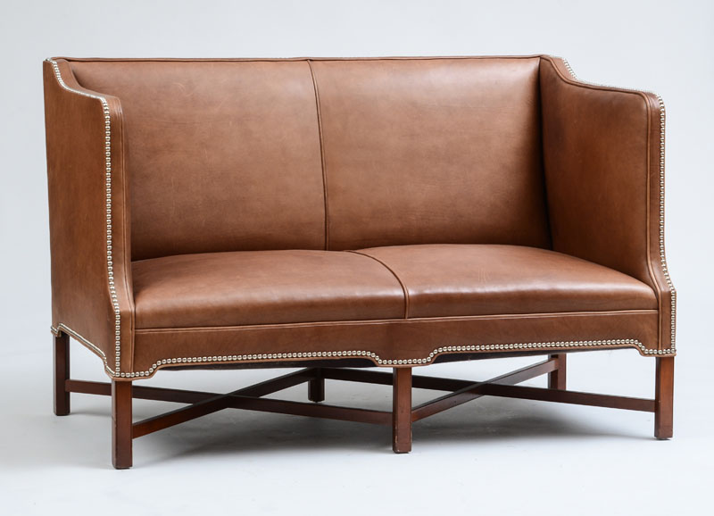 Appraisal: REPRODUCTION SOFA IN THE STYLE OF KAARE KLINT Leather and