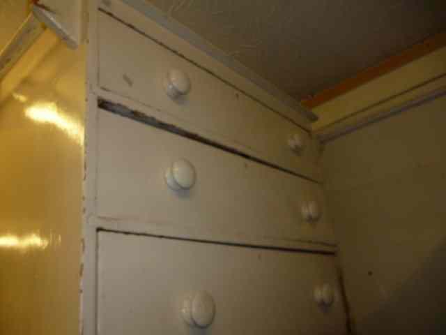 Appraisal: A WHITE PAINTED CHEST of three long drawers standing on