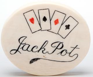 Appraisal: Ivory Jack Pot Chip Large scrimshawed chip in red and