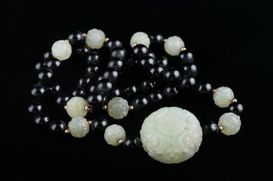 Appraisal: JADE AND BLACK BEAD NECKLACE