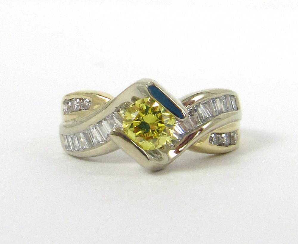 Appraisal: FANCY YELLOW DIAMOND AND FOURTEEN KARAT GOLD RING The k