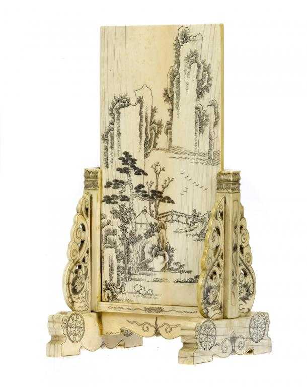 Appraisal: A CHINESE IVORY TABLE SCREEN engraved with a landscape with