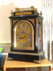 Appraisal: A large and impressive ebonised mantel clock with gilt mounts