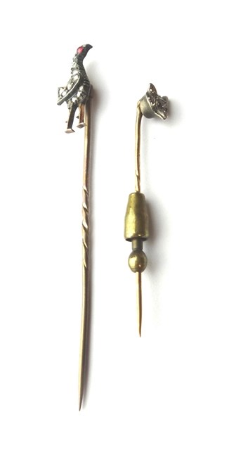 Appraisal: A rose diamond set stick pin designed as a standing