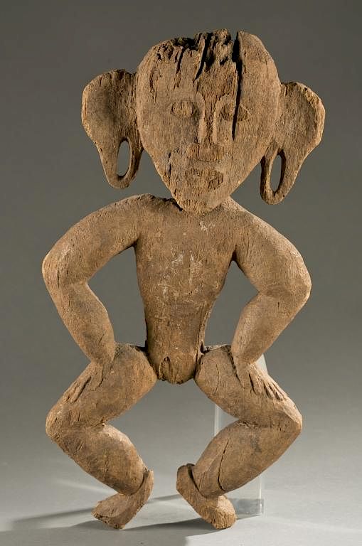 Appraisal: Indonesian standing figure th cen A semi-flattened standing figure arms