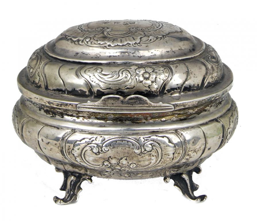 Appraisal: A RUSSIAN OVAL SUGAR BOX spirally lobed and chased with