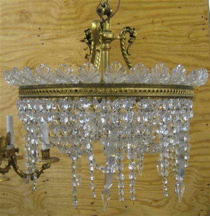 Appraisal: Crystal and brass circular chandelier The brass ring strung with