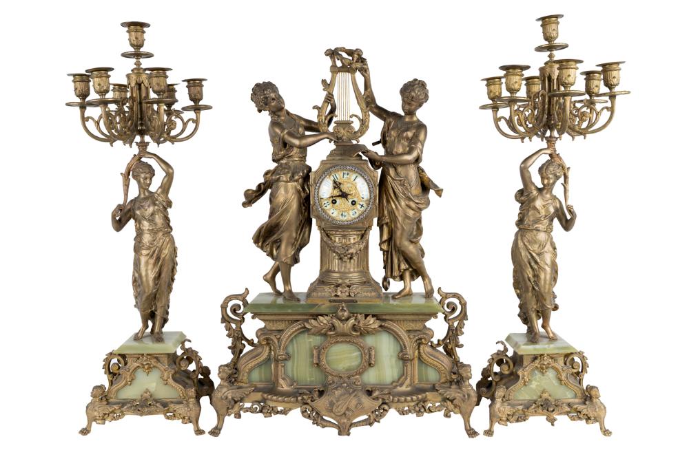 Appraisal: CLOCK GARNITURE SETgilt metal and onyx comprising a mantel clock