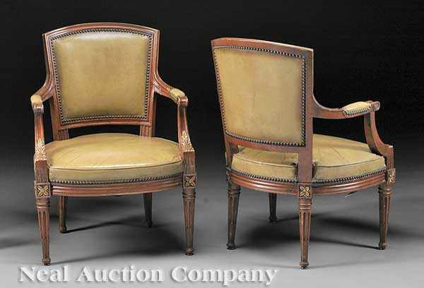 Appraisal: A Pair of Louis XVI-Style Walnut and Parcel Gilt Fauteuils