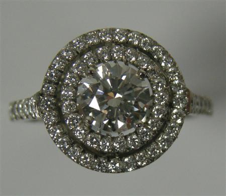 Appraisal: An all diamond cluster ring claw set to the centre