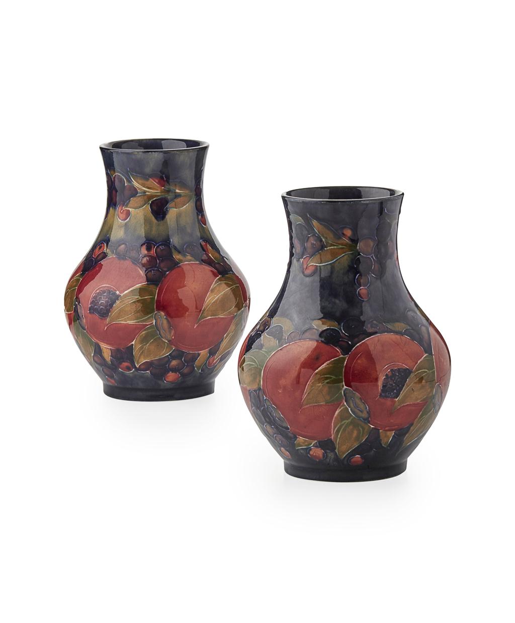 Appraisal: MOORCROFT POTTERY PAIR OF 'POMEGRANATE' PATTERN BALUSTER VASES S with