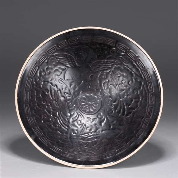 Appraisal: Chinese black glazed molded dish with interior floral designs and