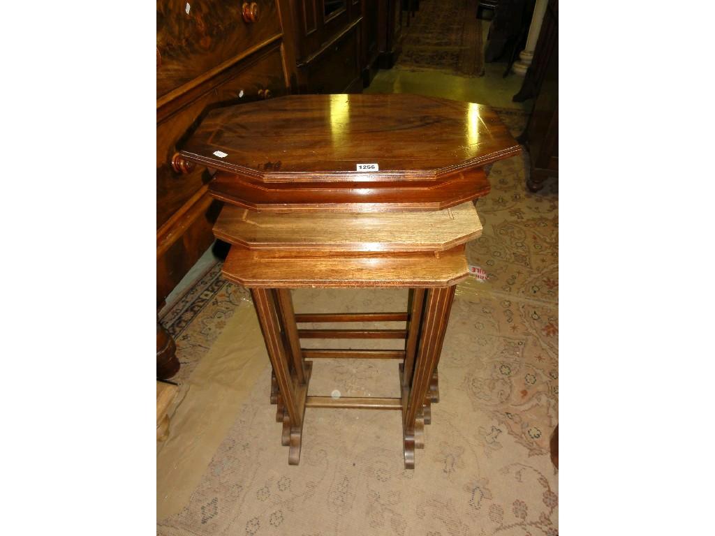 Appraisal: An Edwardian quortetto nest of mahogany occasional tables of lozenge