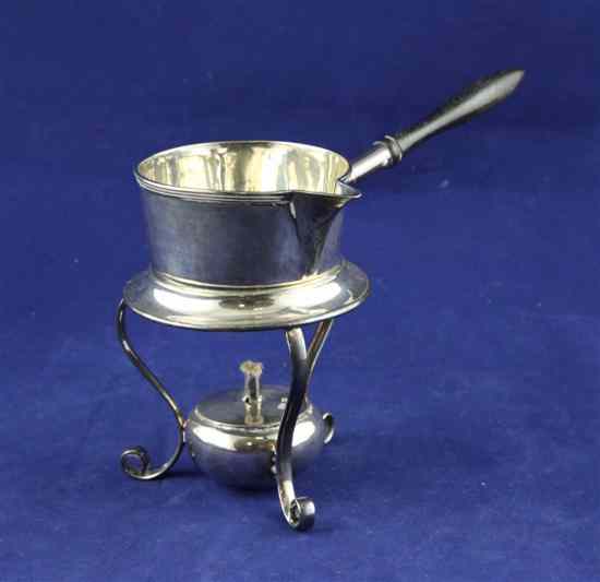 Appraisal: An Edwardian silver brandy warmer on stand with burner with