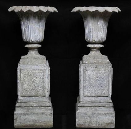 Appraisal: PAIR OF ARTIFICIAL STONE URNS ON PEDESTALS The bowls on