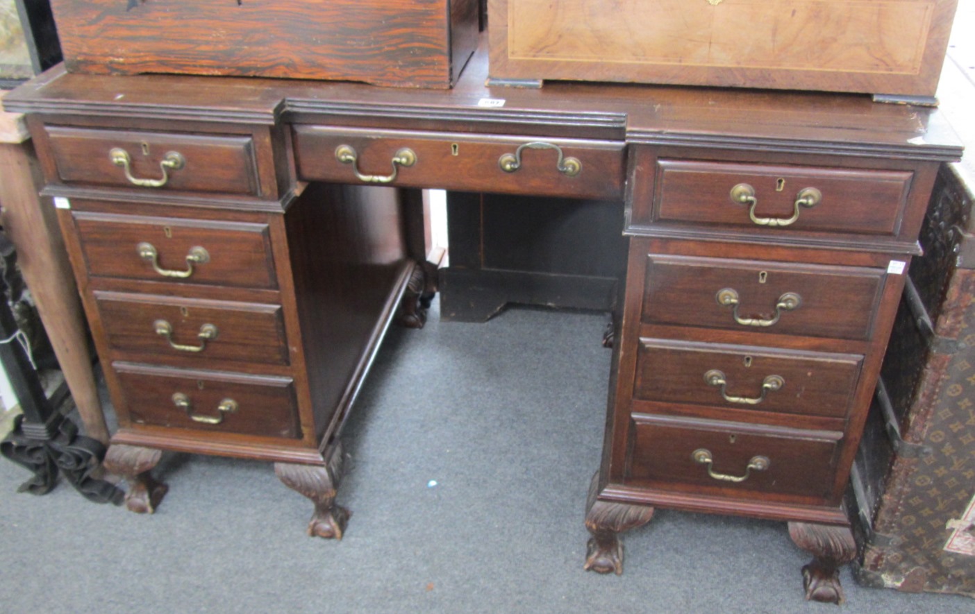 Appraisal: An early th century walnut inverted breakfront pedestal desk with