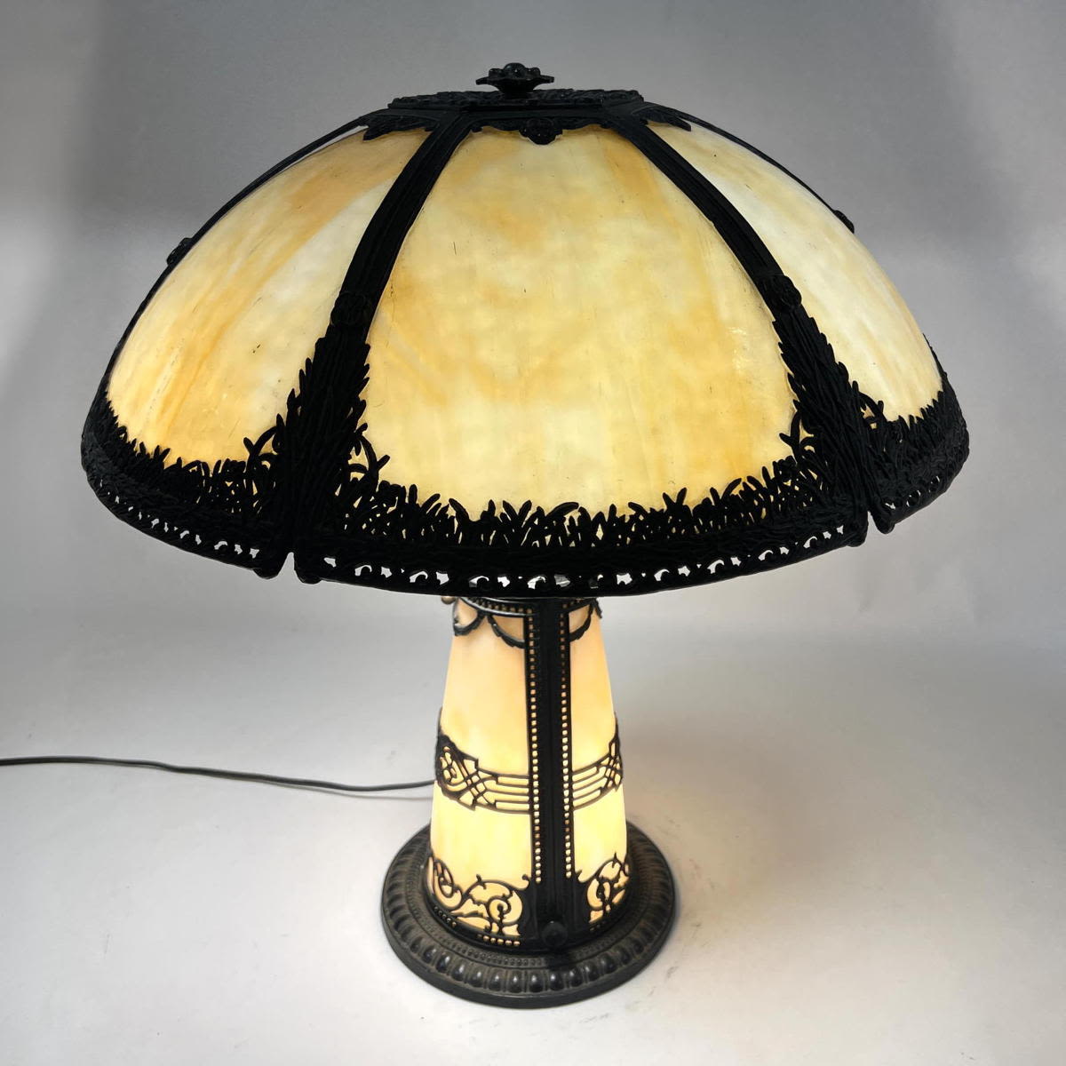 Appraisal: Carmel Slag glass lamp with ornate light up base Filigree