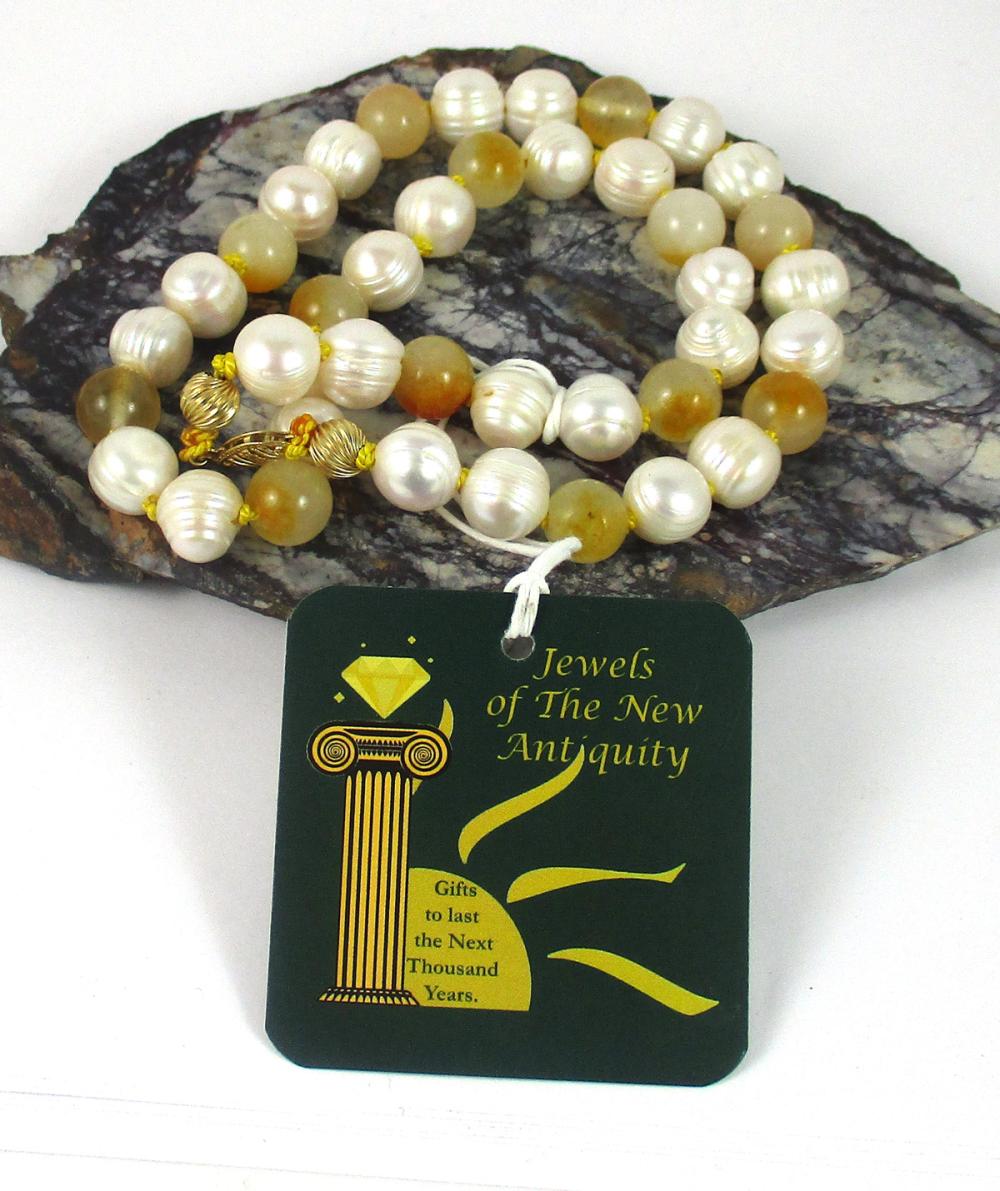 Appraisal: PRINCESS LENGTH YELLOW JADE AND PEARL NECKLACE - hand-knotted strand