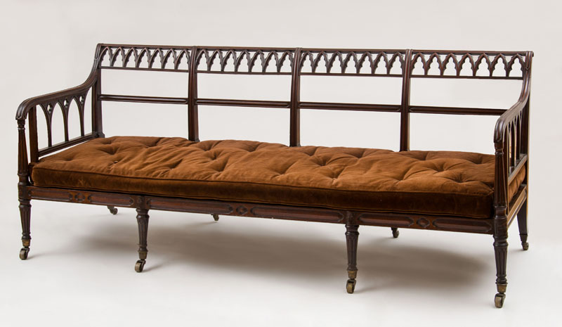 Appraisal: WILLIAM IV CARVED MAHOGANY AND CANED SETTEE IN THE NEO-GOTHIC