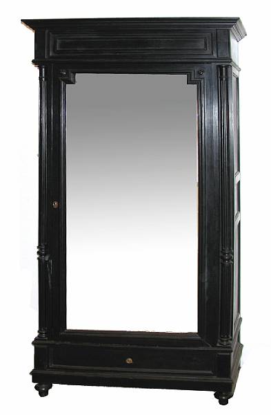 Appraisal: A Napoleon III ebonized wardrobe height ft in width in