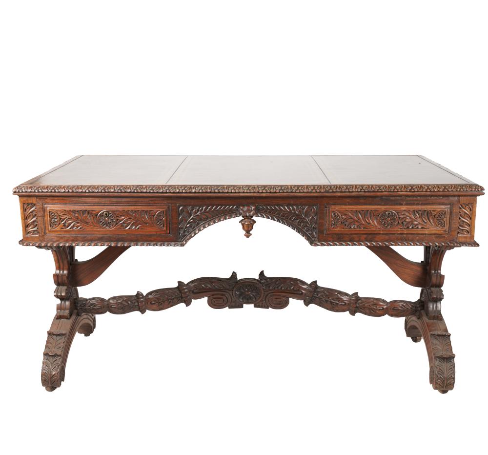 Appraisal: PORTUGUESE-STYLE CARVED OAK WRITING TABLEwith gilt-tooled leather-inset top over two