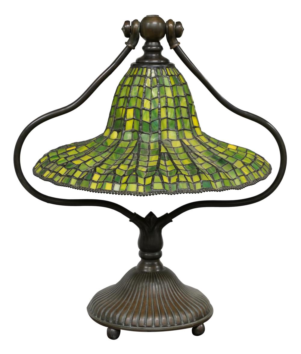 Appraisal: TIFFANY STYLE BRONZE TABLE LAMPwith green leaded glass shade appears