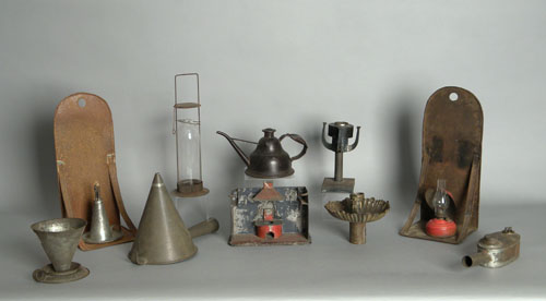 Appraisal: A Butrem four-wick grease lamp together with two tin sconces