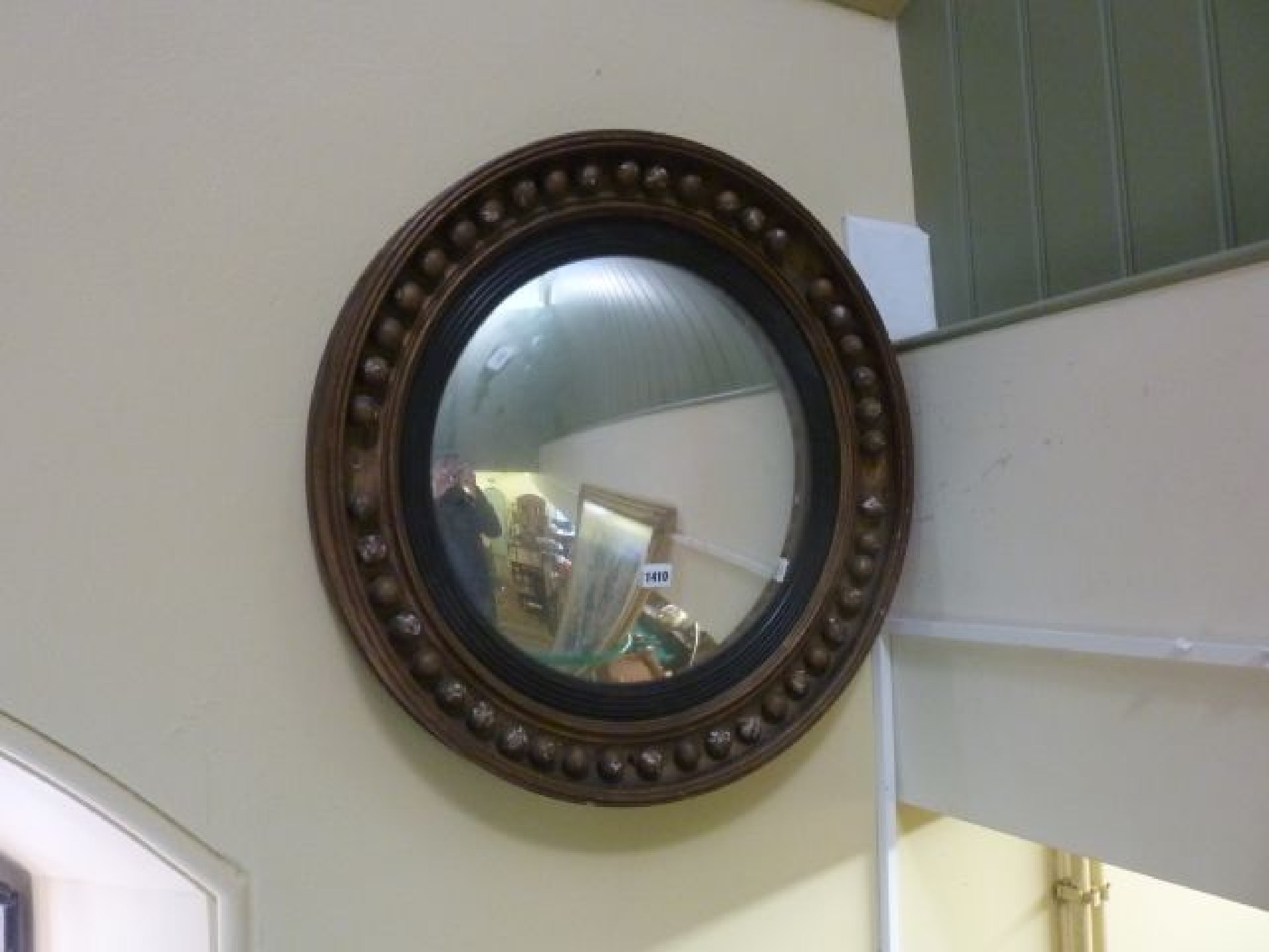 Appraisal: A Regency period convex wall mirror the circular gilded frame