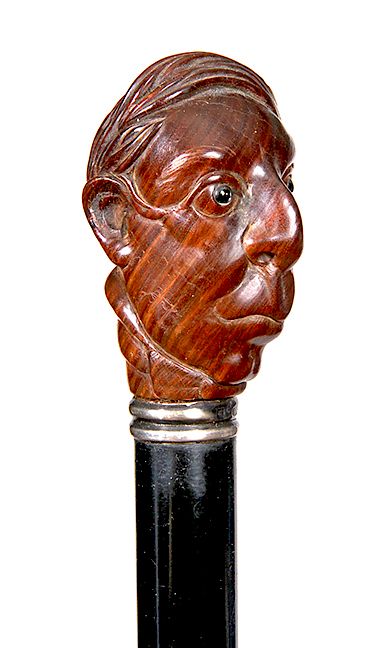 Appraisal: Character Cane- Ca - A carved gentlemen with a wild