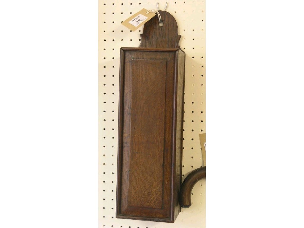 Appraisal: A late Georgian oak wall-hanging candle box arched cresting and