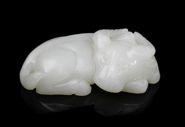 Appraisal: A fine white jade carving of a recumbent water buffalo