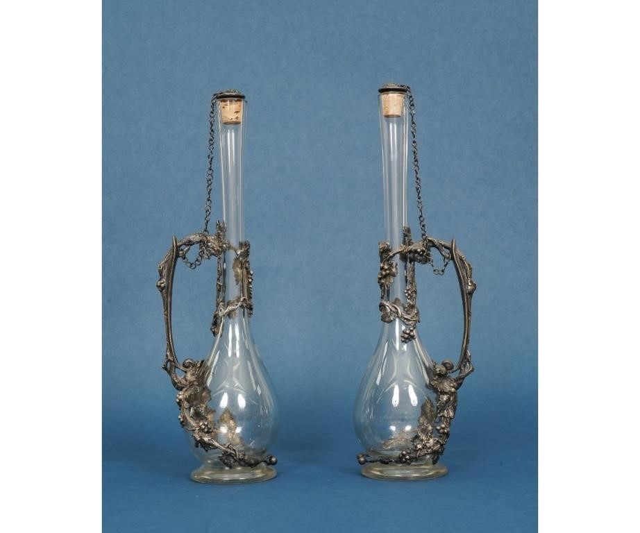 Appraisal: Two Art Nouveau wine glass decanters with silverplate mounts h