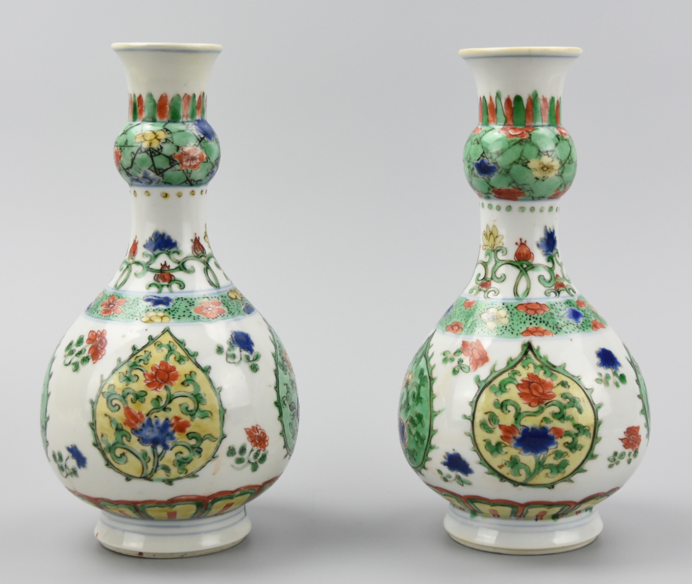 Appraisal: PAIR OF CHINESE WUCAI GARLIC HEAD VASES KANGXI P A