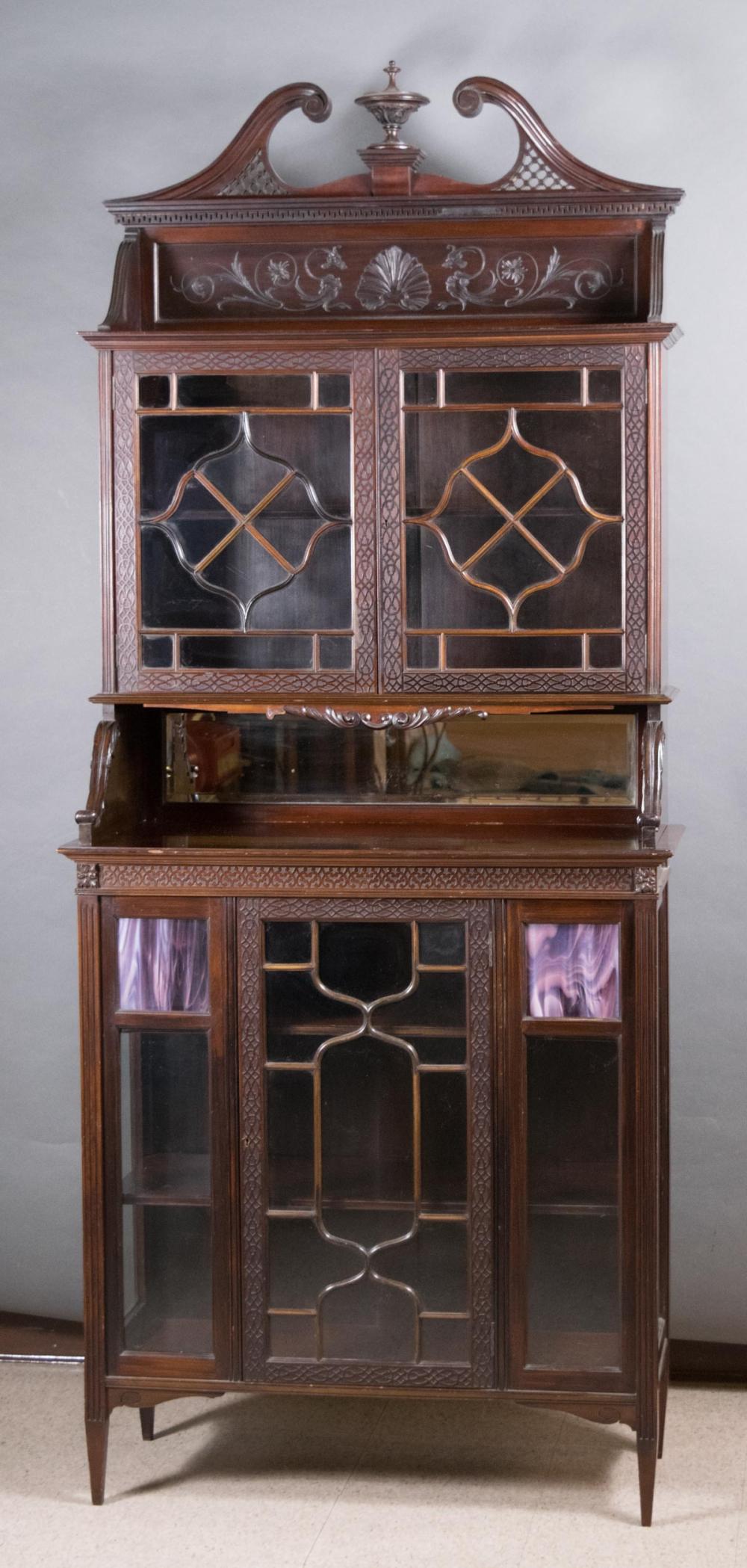 Appraisal: AN EDWARDIAN MAHOGANY CURIO BOOKCASE CABINET ON CABINET Chippendale Revival