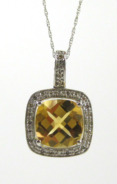 Appraisal: CITRINE AND DIAMOND PENDANT NECKLACE with an inch k white