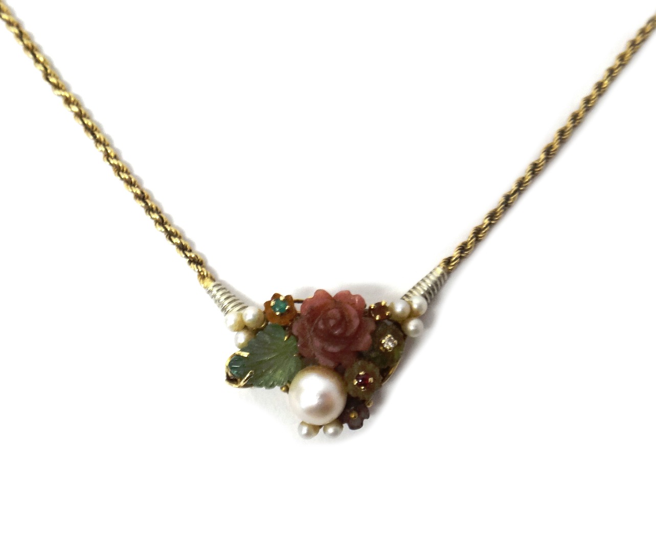 Appraisal: An Italian gold faceted and carved gemstone and cultured pearl