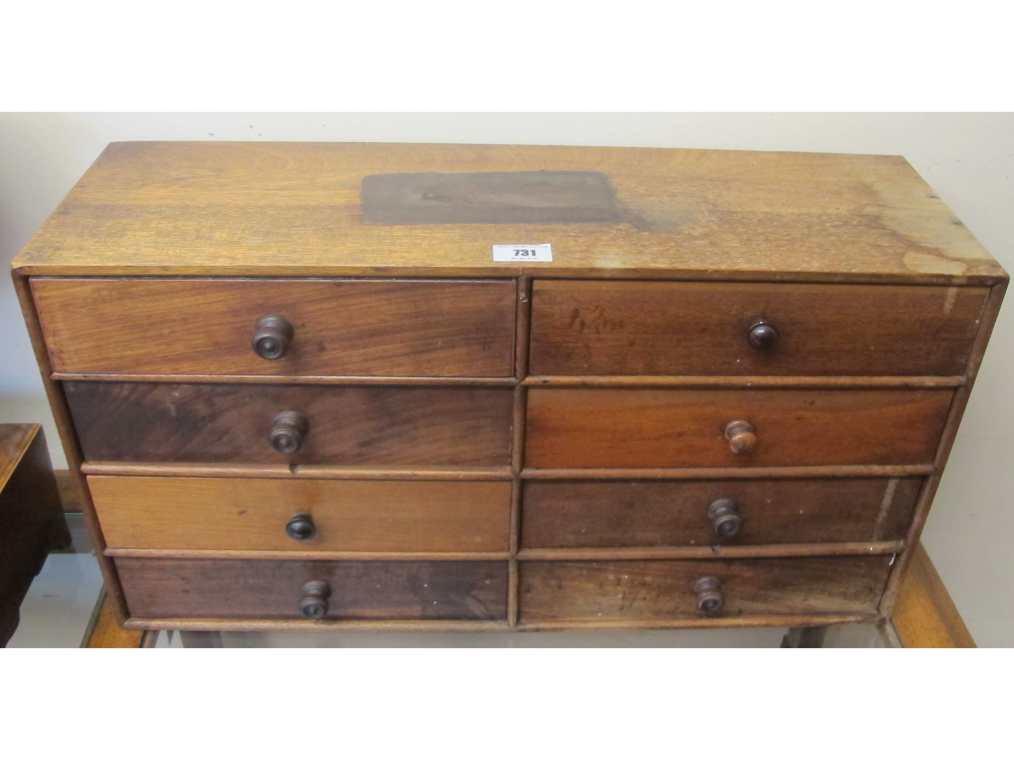 Appraisal: A mahogany eight drawer collectors chest