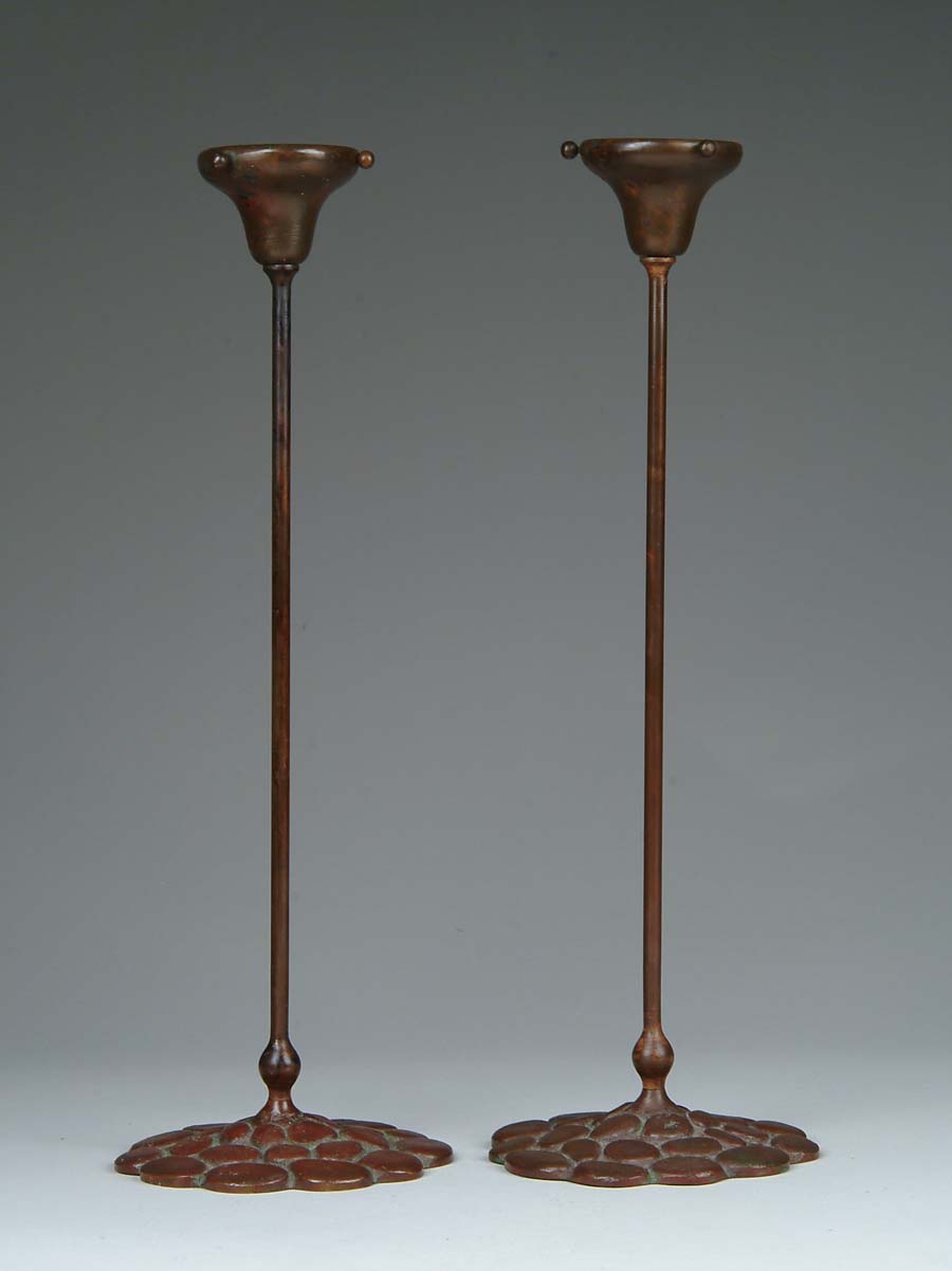 Appraisal: PAIR OF BRONZE CANDLESTICKS Interesting bronze candlesticks have pebble design