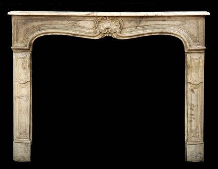 Appraisal: ROCOCO-STYLE CARVED CARRARA MARBLE MANTLEPIECE The serpentine-fronted molded shelf above