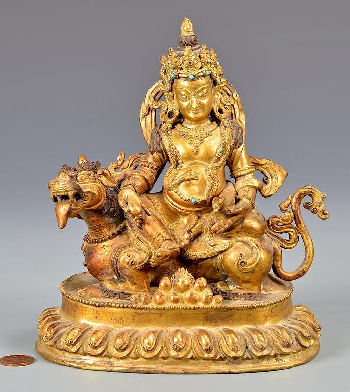 Appraisal: Sino-Tibetan Gilt Bronze Deity on Lion Sino-Tibetan parcel gilt bronze