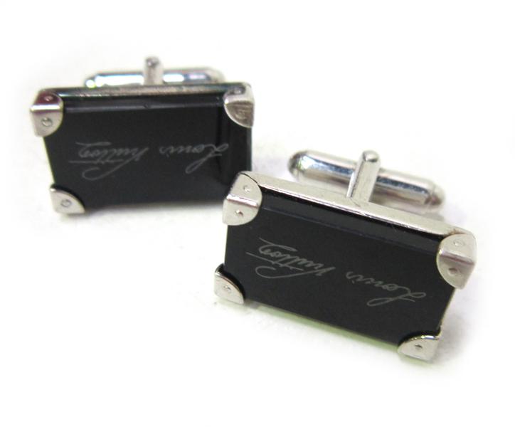 Appraisal: A PAIR OF LOUIS VUITTON CUFFLINKS IN BLACK COMPOSITE WITH