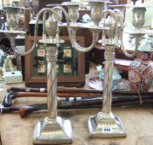 Appraisal: A pair of Old Sheffield plate three light candelabra the