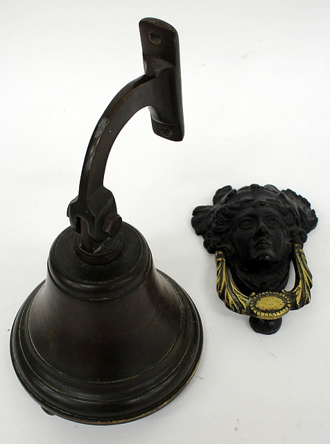 Appraisal: A BRONZE BELL on suspension bracket cm tall together with