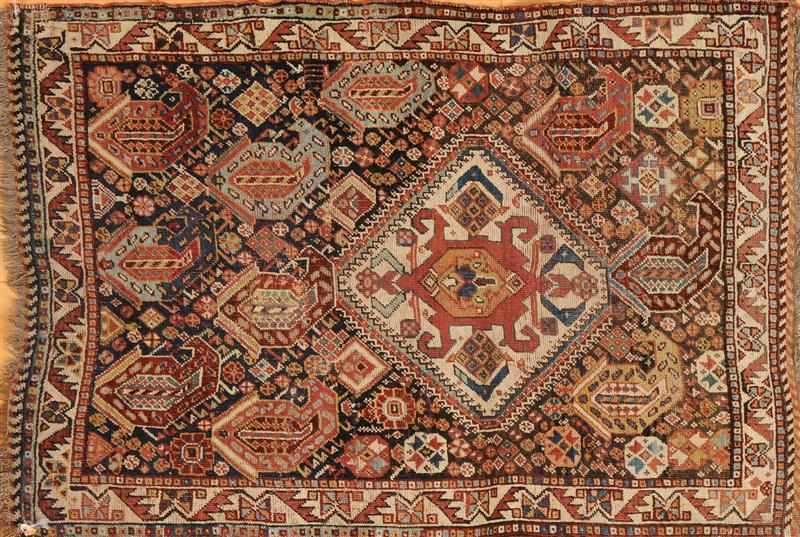 Appraisal: QASHQAI RUG The cobalt ground worked with off-center hooked ivory