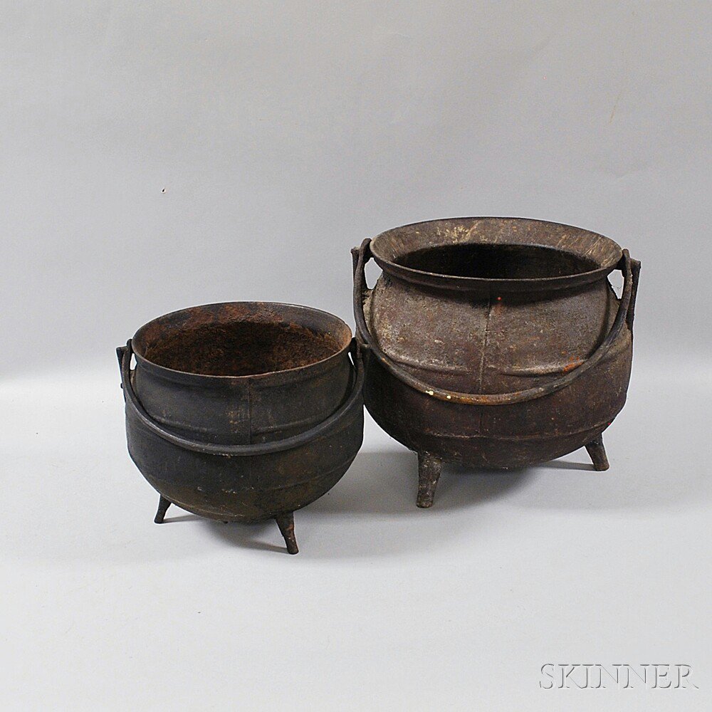 Appraisal: Two Cast Iron Pots th century the round-bellied bodies on