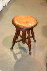 Appraisal: An adjustable stool with ball and claw feet