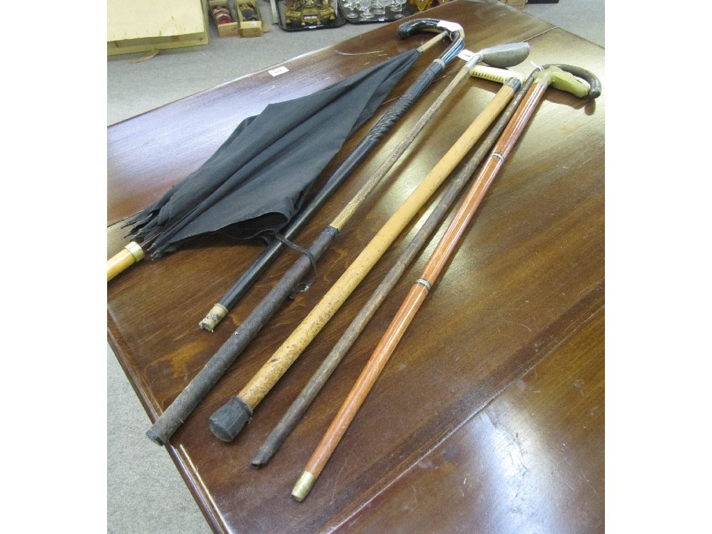 Appraisal: Five assorted walking canes and a hickory shafted putter