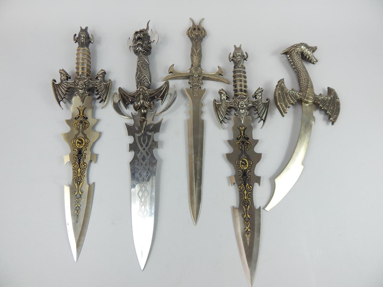 Appraisal: A collection of long bladed fantasy knives with large serrated