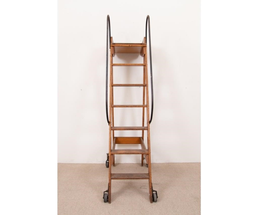 Appraisal: Large Putnam rolling oak library ladder th c with iron